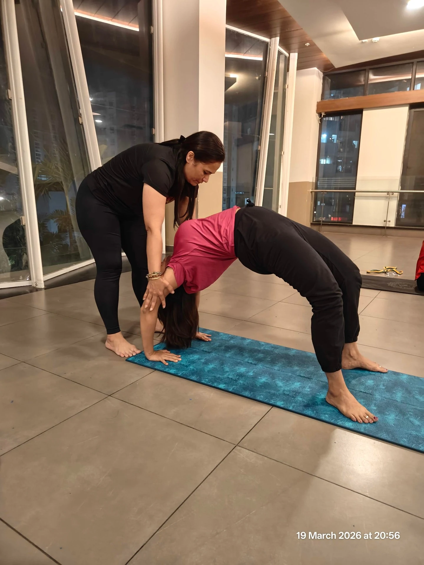 Chakrasana Yoga Practice - Jigisha assisting student in Wheel Pose at Yoga With Jigisha Bangalore March 2026