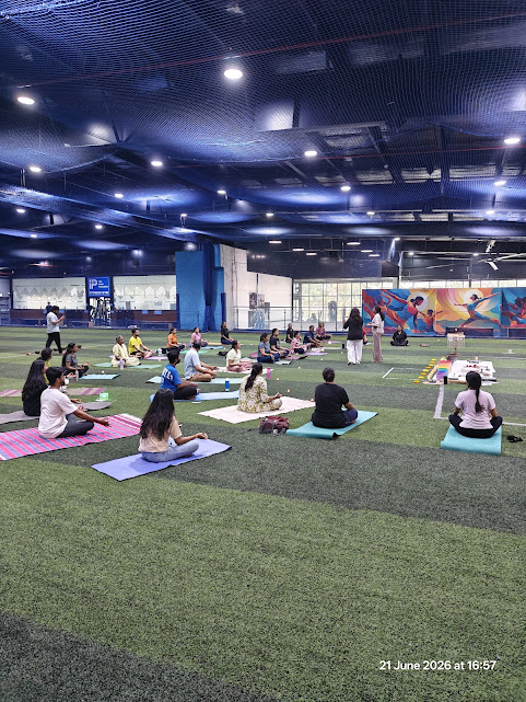 International Day of Yoga 21st June 2026 - Participants in seated meditation on yoga mats inside the spacious indoor turf at Decathlon Bannerghatta Road Bangalore - Sound Bath Event by Yoga With Jigisha