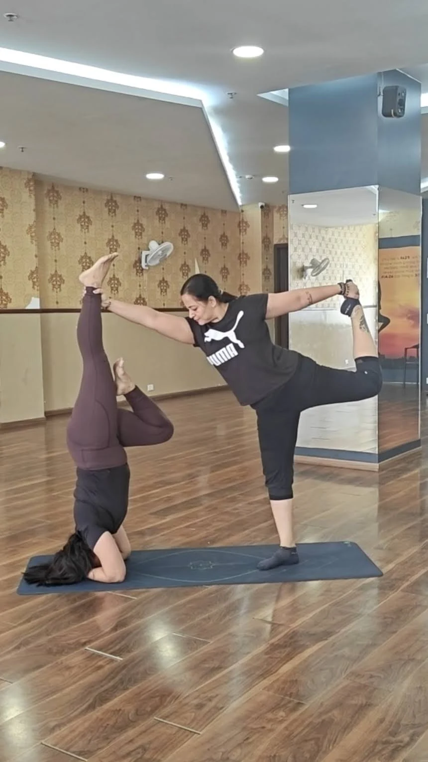 Jigisha and Pooja Partner Yoga - Headstand and Natarajasana combination at Yoga With Jigisha studio