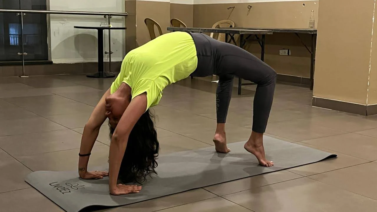 Krupa performing Chakrasana Wheel Pose - Yoga With Jigisha student in perfect backbend at Bangalore studio March 2026
