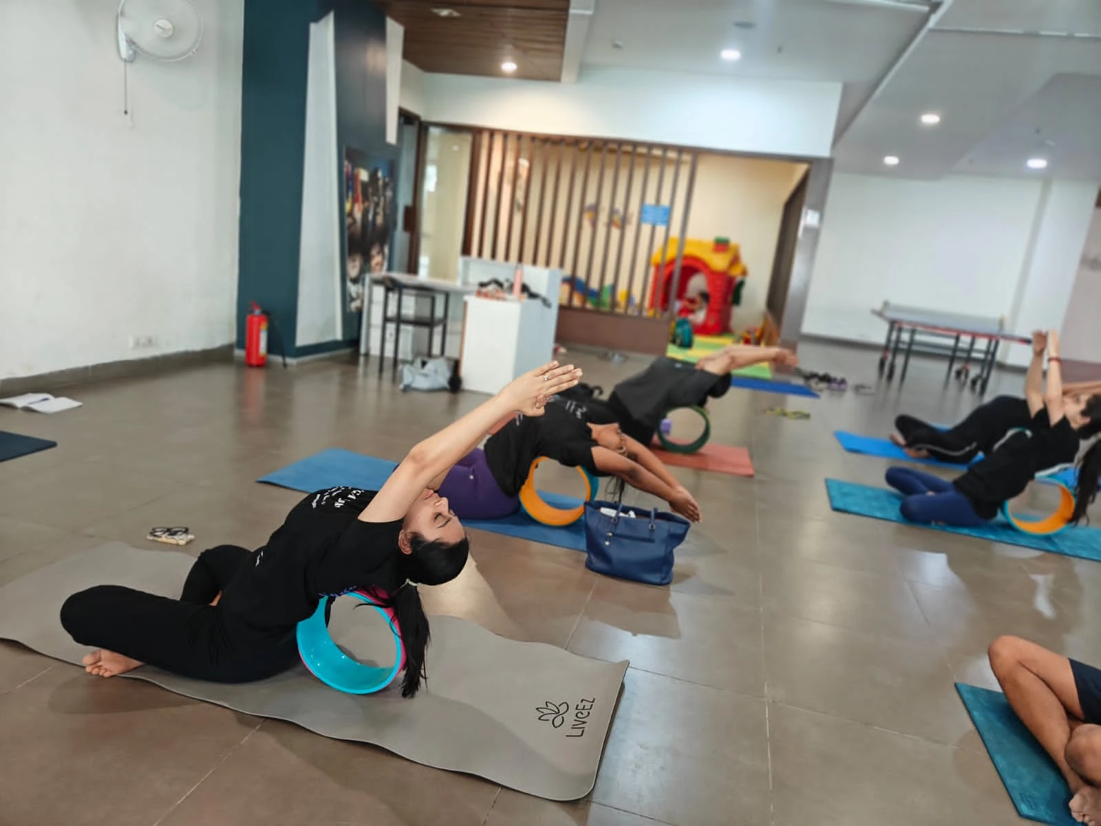 Advanced Wheel Yoga Pose - Student demonstrating perfect form in Urdhva Dhanurasana with Jigisha's guidance