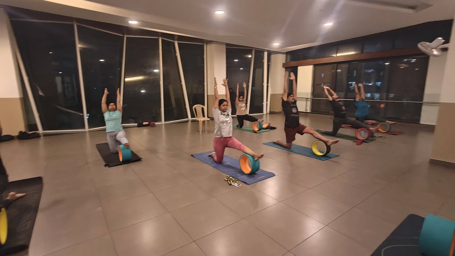 Group Wheel Yoga Session - Community wheel practice for strength and flexibility