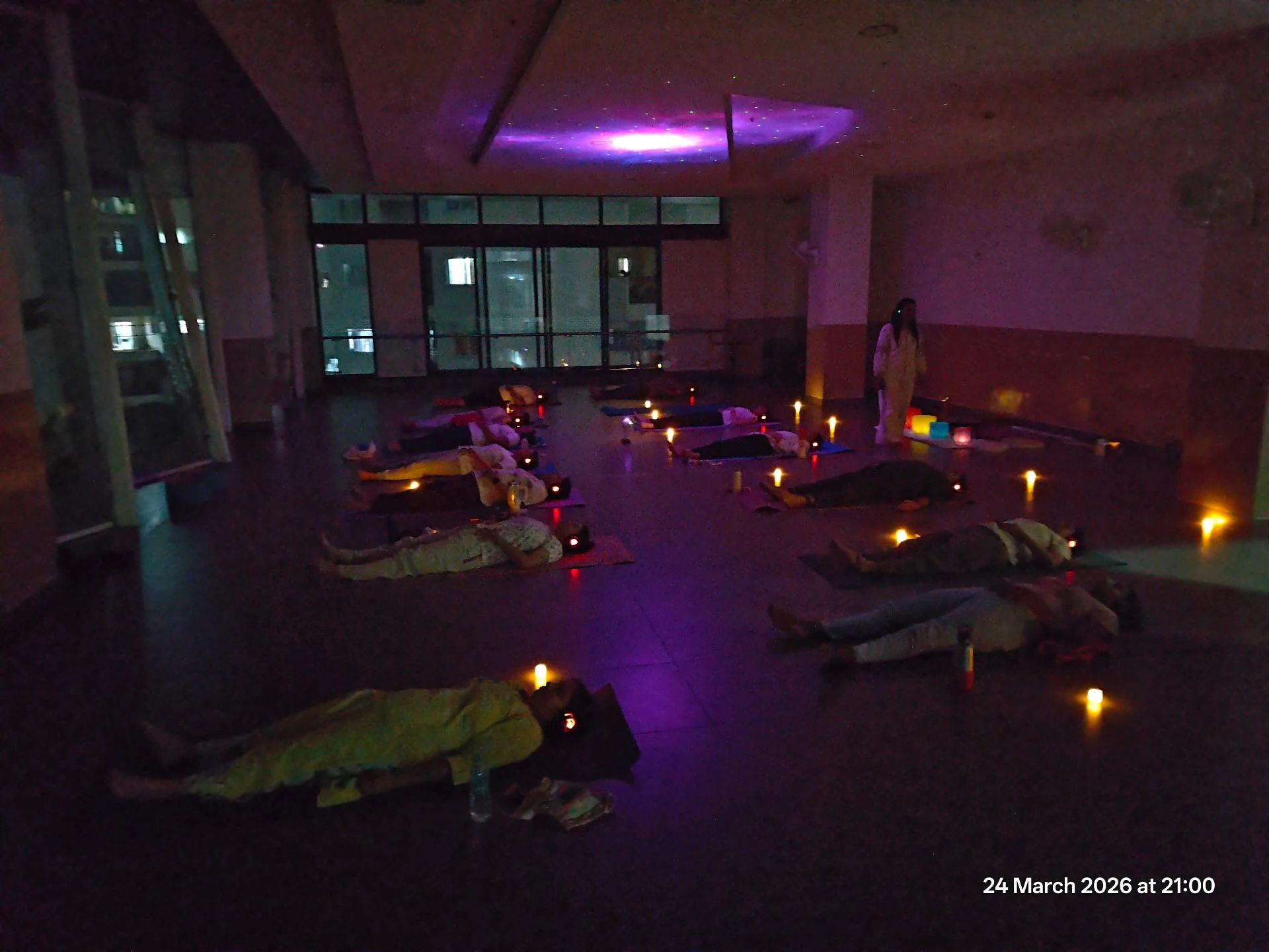 Candlelit Sound Healing Savasana with starry ceiling and group in deep relaxation at Yoga With Jigisha Bangalore