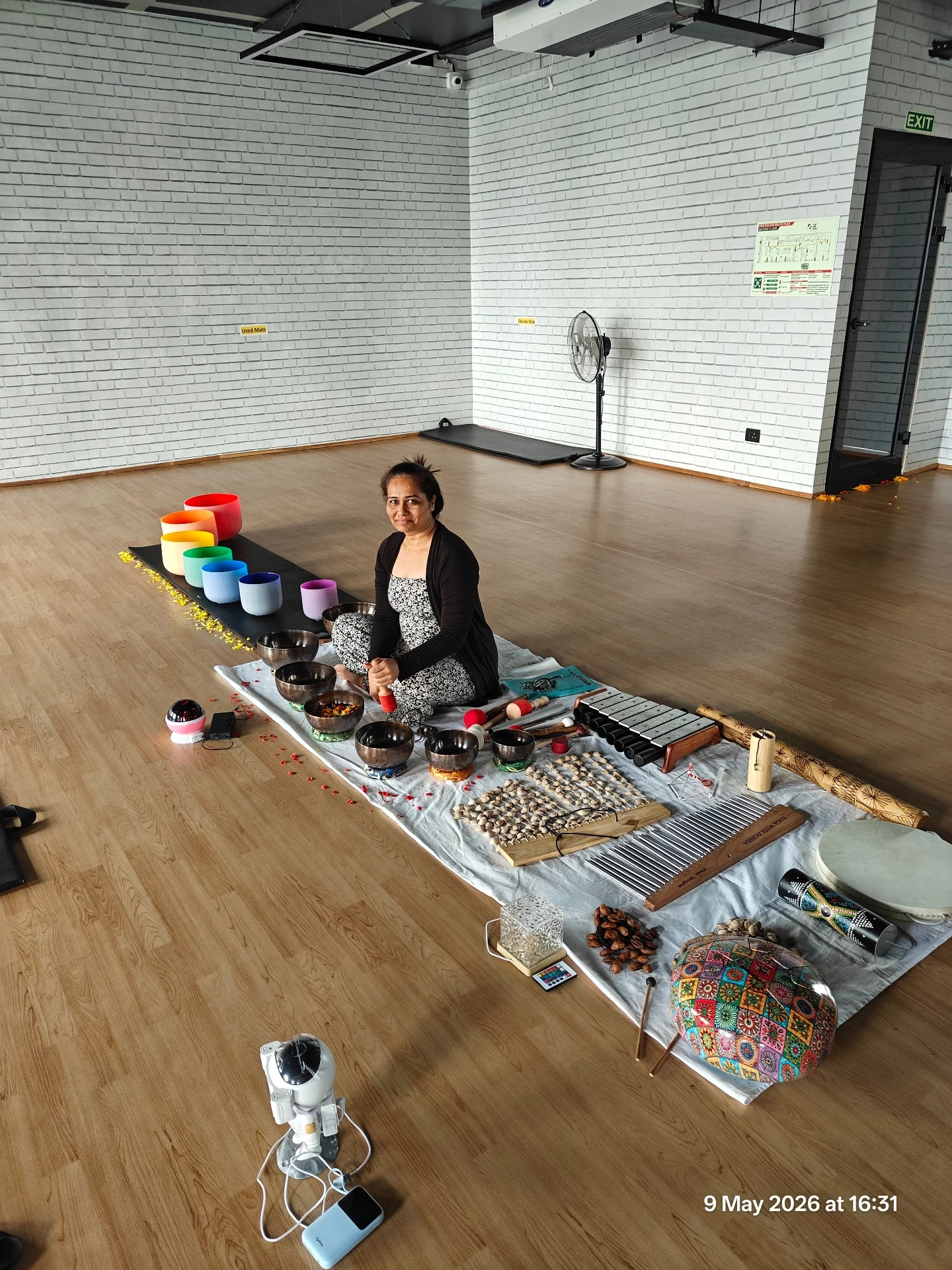 Jigisha Parikh with full setup of Crystal Singing Bowls Full Moon Bowls Full Moon Metal Singing Bowls Xylophone Wind Chimes Rain Stick and accessories - Yoga With Jigisha Bangalore