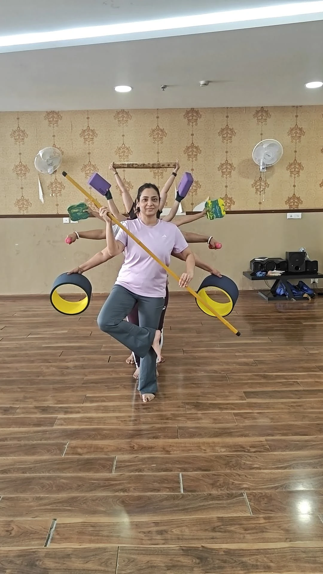 Yoga With Jigisha instructor demonstrating creative yoga pose with multiple props including wheels, sticks and dumbbells for Women's Day 2026 Bangalore